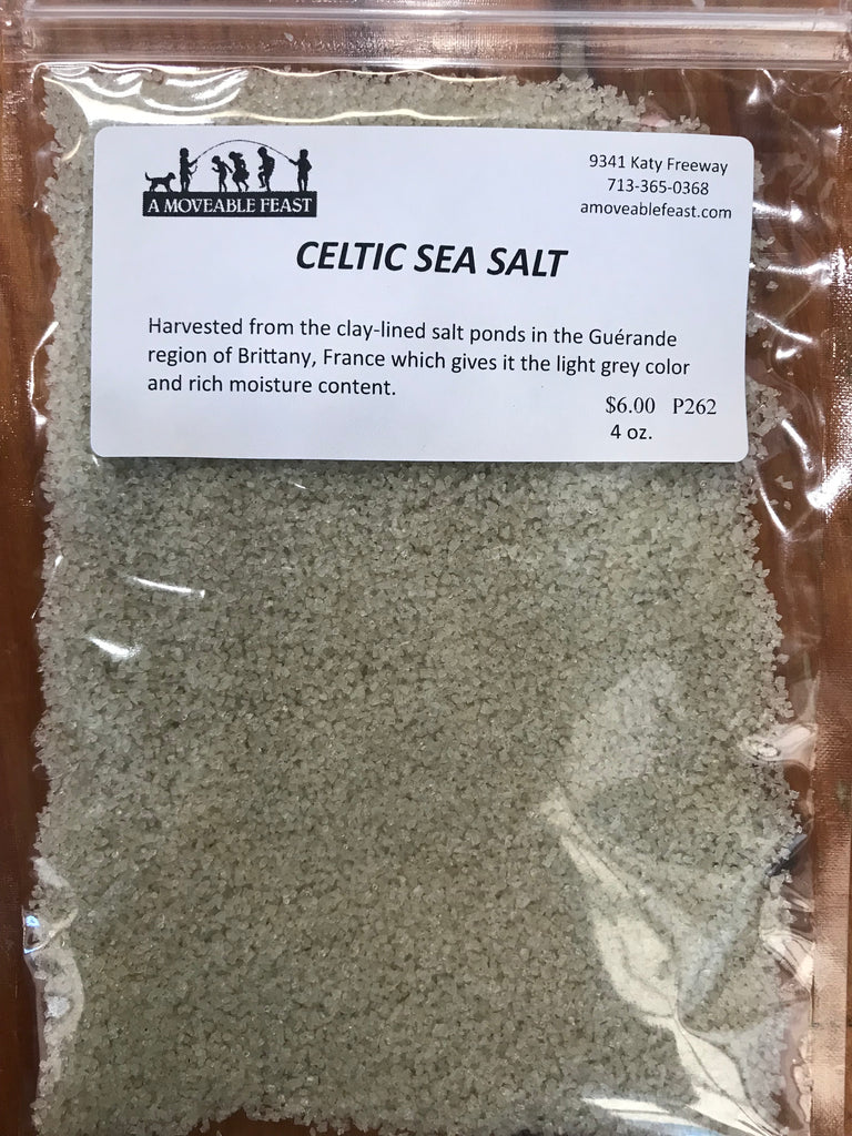 A resealable plastic pouch containing 4 ounces of Celtic grey Sea Salt.  The white pouch label depicts the A Moveable Feast logo and physical address with contract info.